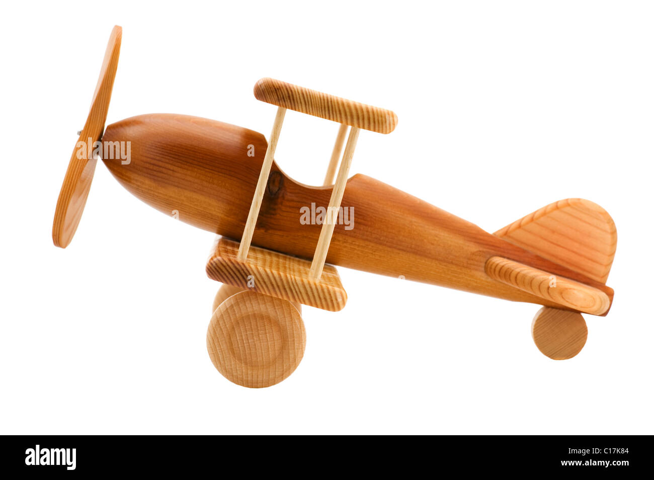 Objekt auf weiß - hölzernes Spielzeugflugzeug Stockfoto