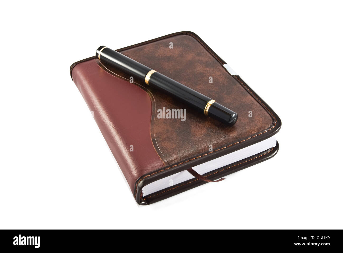Business-Tagebuch und Stift ist isoliert auf weiss Stockfoto