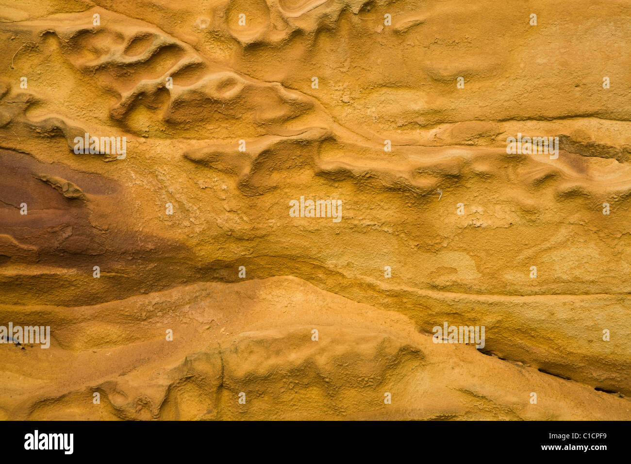 Strukturierte Oberfläche der Sandstein Felswand, South Shields. Stockfoto