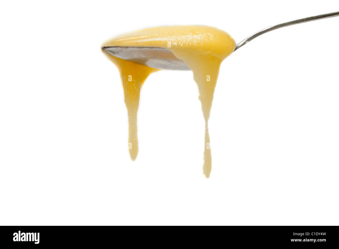 Löffel Honig herabfließende Eisen, drop, isoliert auf weißem Hintergrund Stockfoto