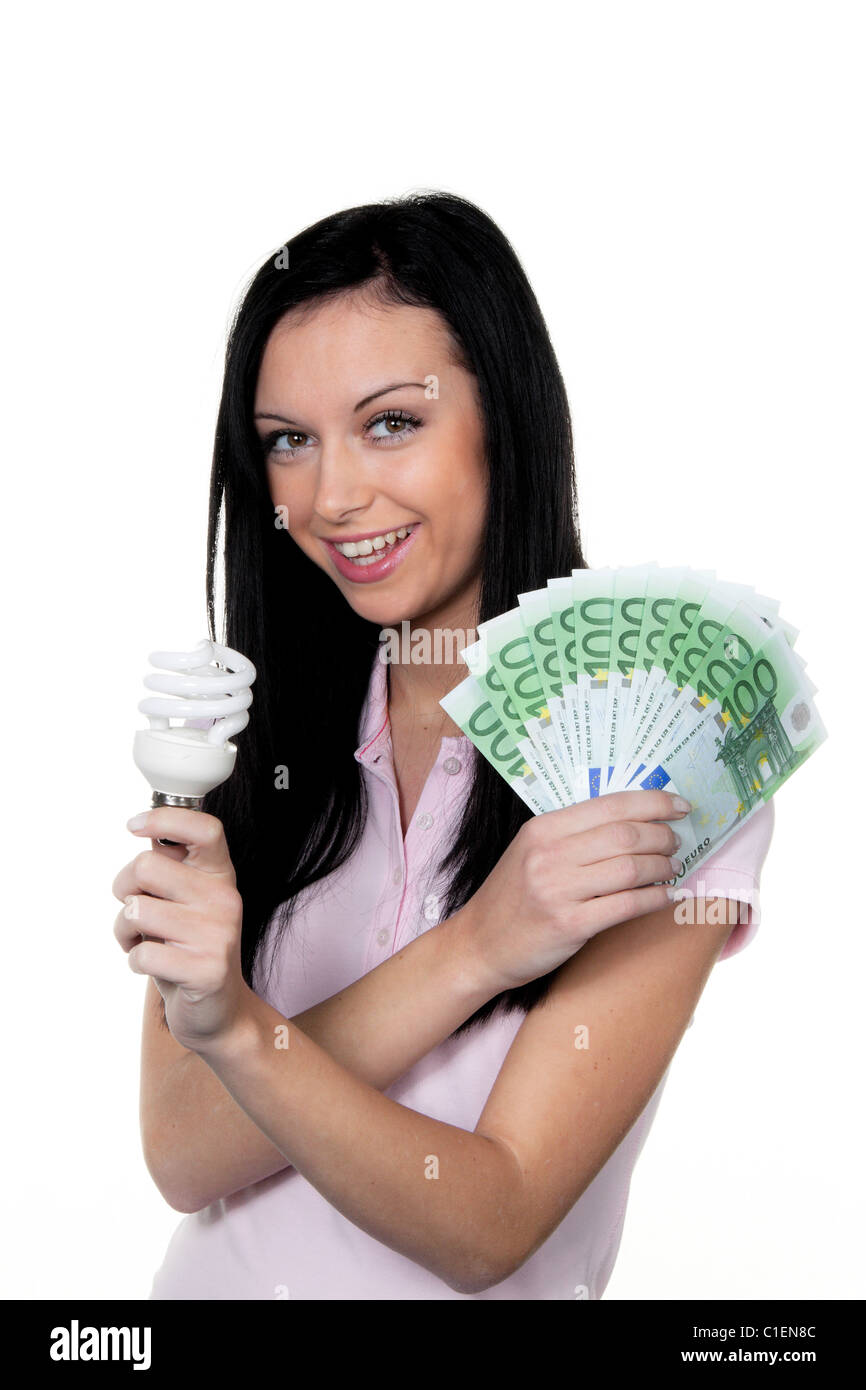 Frauen mit Energiesparlampe. Energiesparende Lampe und Euro-Währung Stockfoto