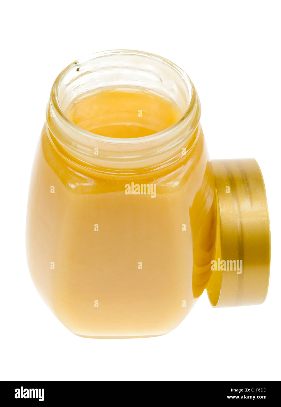 Ein Glas Honig isoliert auf weißem Hintergrund Stockfoto