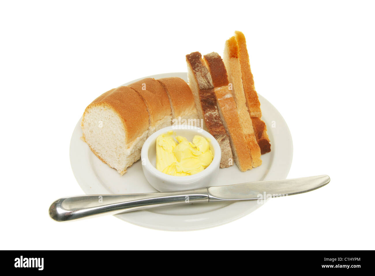 Auswahl an Brot mit Butter und ein Messer auf einem Teller Stockfoto