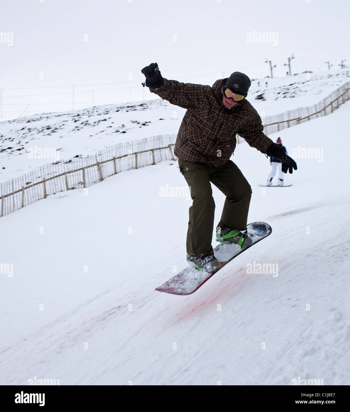 Glenshee Skizentrum Snowboarder springen Cairngorms Schottland UK Europe Stockfoto