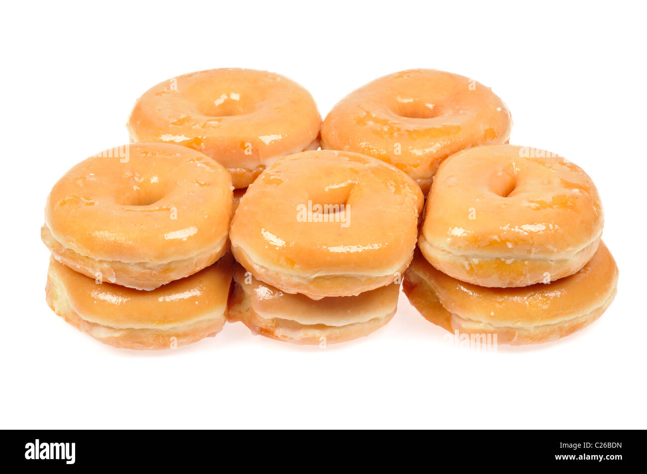 Stapel von glasierte Donuts auf weißem Hintergrund ausschneiden. Stockfoto