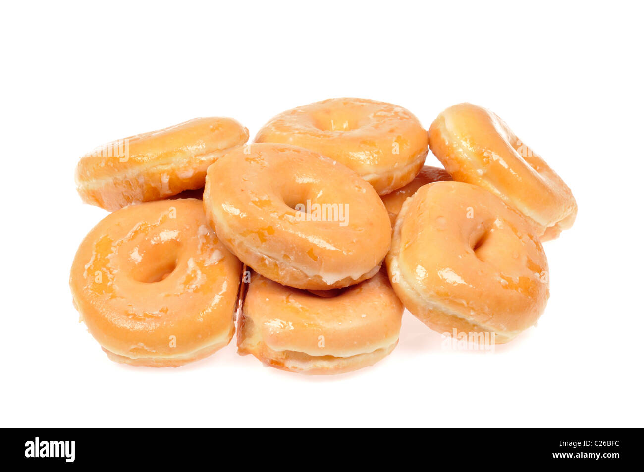 Haufen von glasierte Donuts auf weißem Hintergrund, ausgeschnitten. Stockfoto