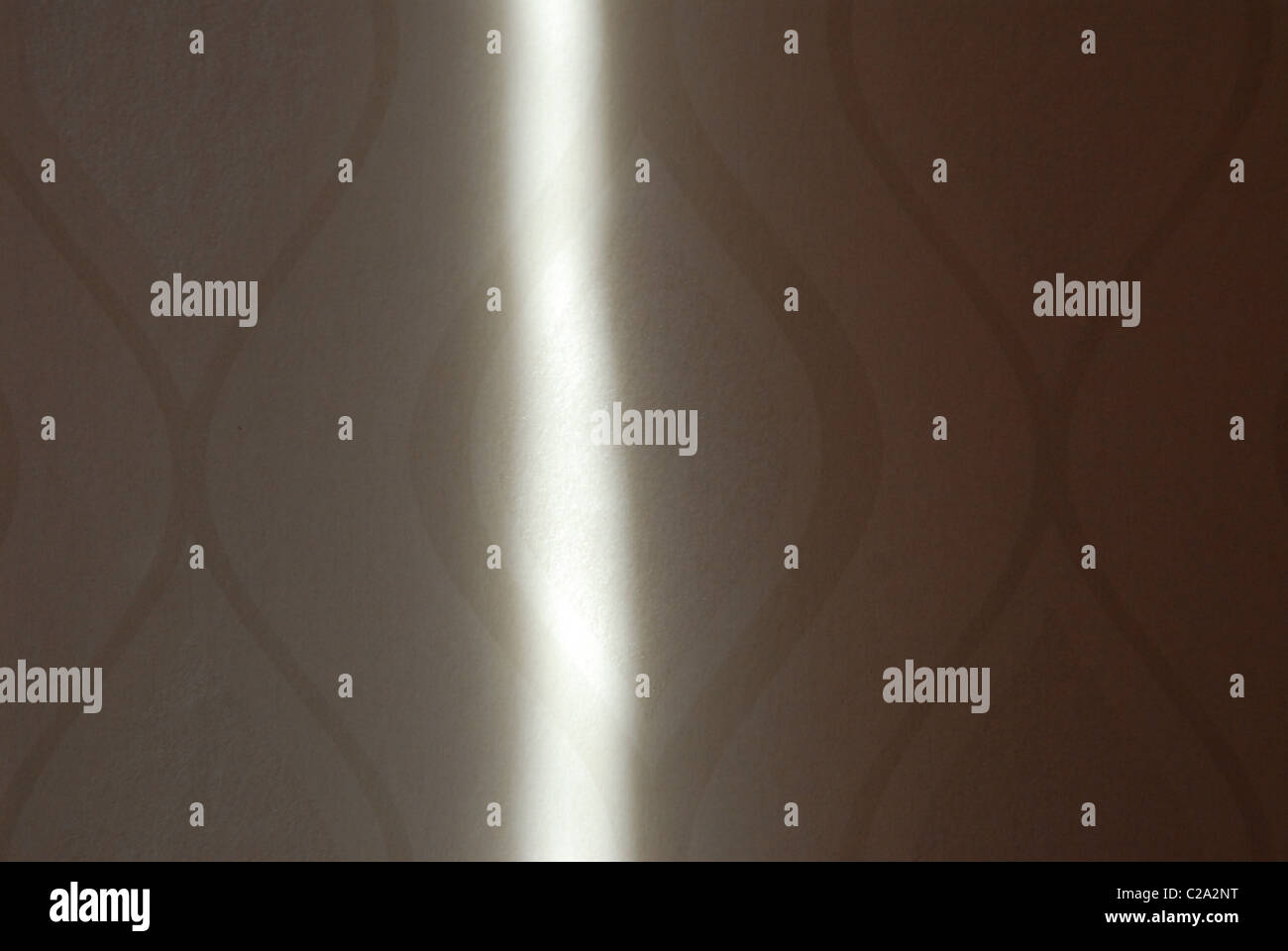 Sonnenstrahl auf Tapete. Stockfoto