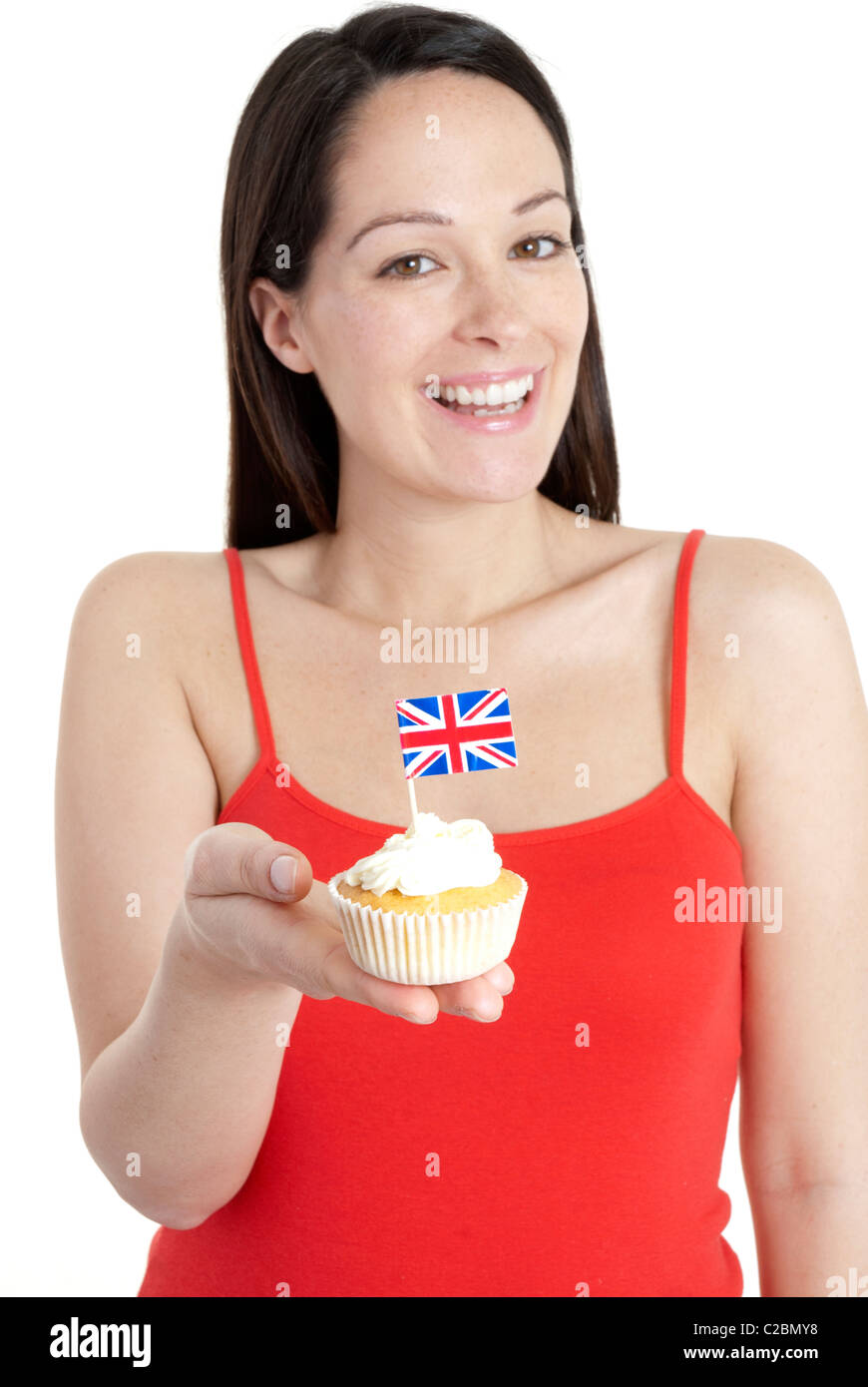 Glückliche Frau hält Cupcake mit Union Jack-Flagge - Feier, party Stockfoto