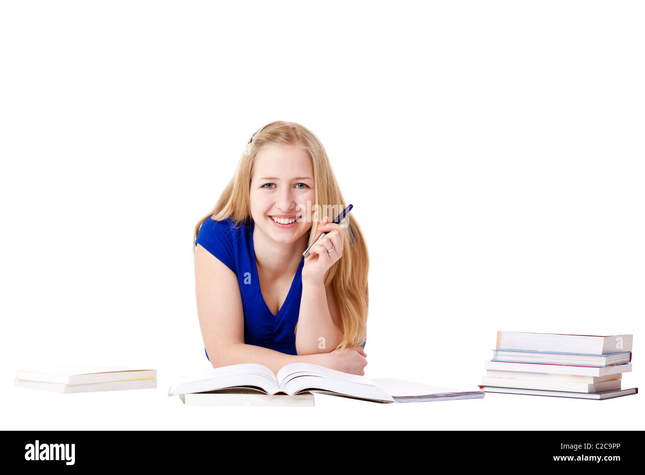 Glücklich, junge, attraktive Frau lernt am Boden mit Büchern. Isoliert auf weißem Hintergrund. Stockfoto