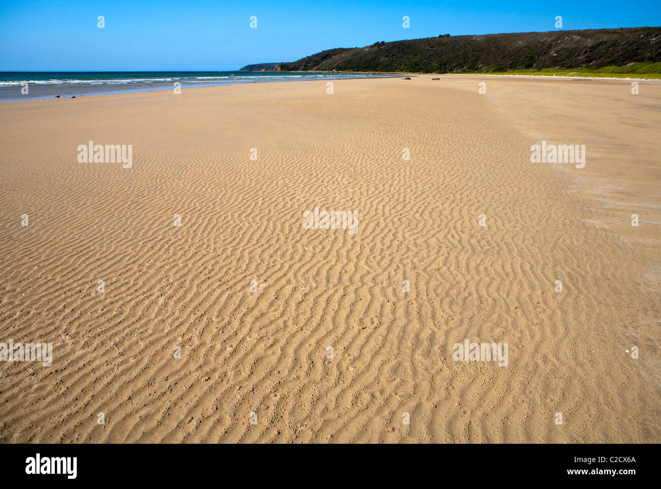 Sand Wellen am Strand von Bäcker Stockfoto