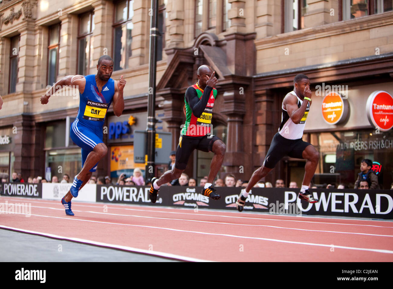 Tyson Gay, Kim Collins und Pierre konkurrieren in Manchester Stadt Spiele 200m Rennen auf einer temporären Strecke am Deansgate. Stockfoto