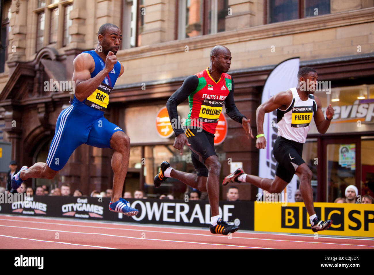 Tyson Gay, Kim Collins und Pierre konkurrieren in Manchester Stadt Spiele 200m Rennen auf einer temporären Strecke am Deansgate. Stockfoto