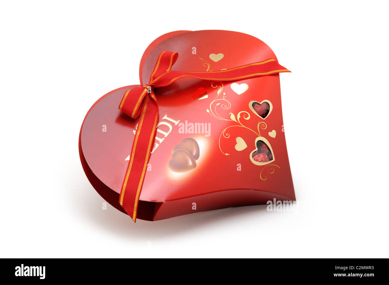 Herzförmige Pralinenschachtel mit Schokolade Stockfoto