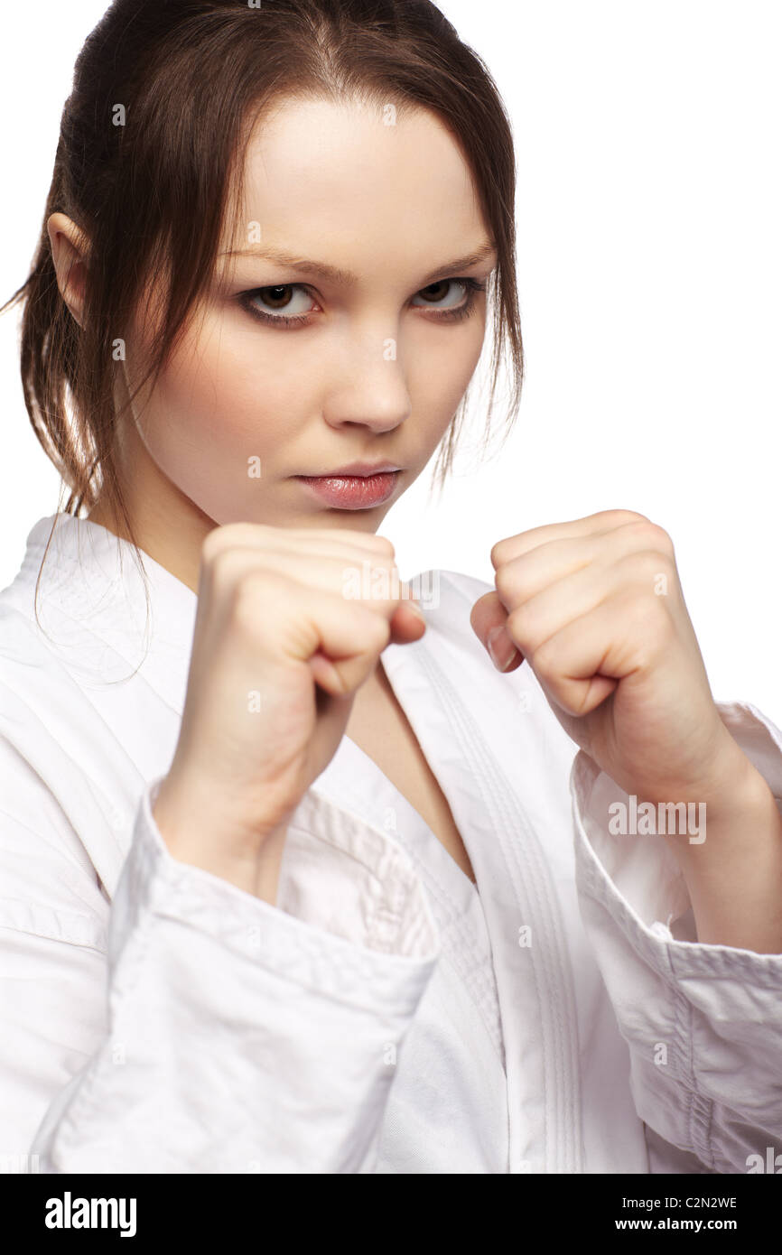 isolierte Portrait schöne Martial-Arts-Mädchen im Kimono Excercising Karate kata Stockfoto