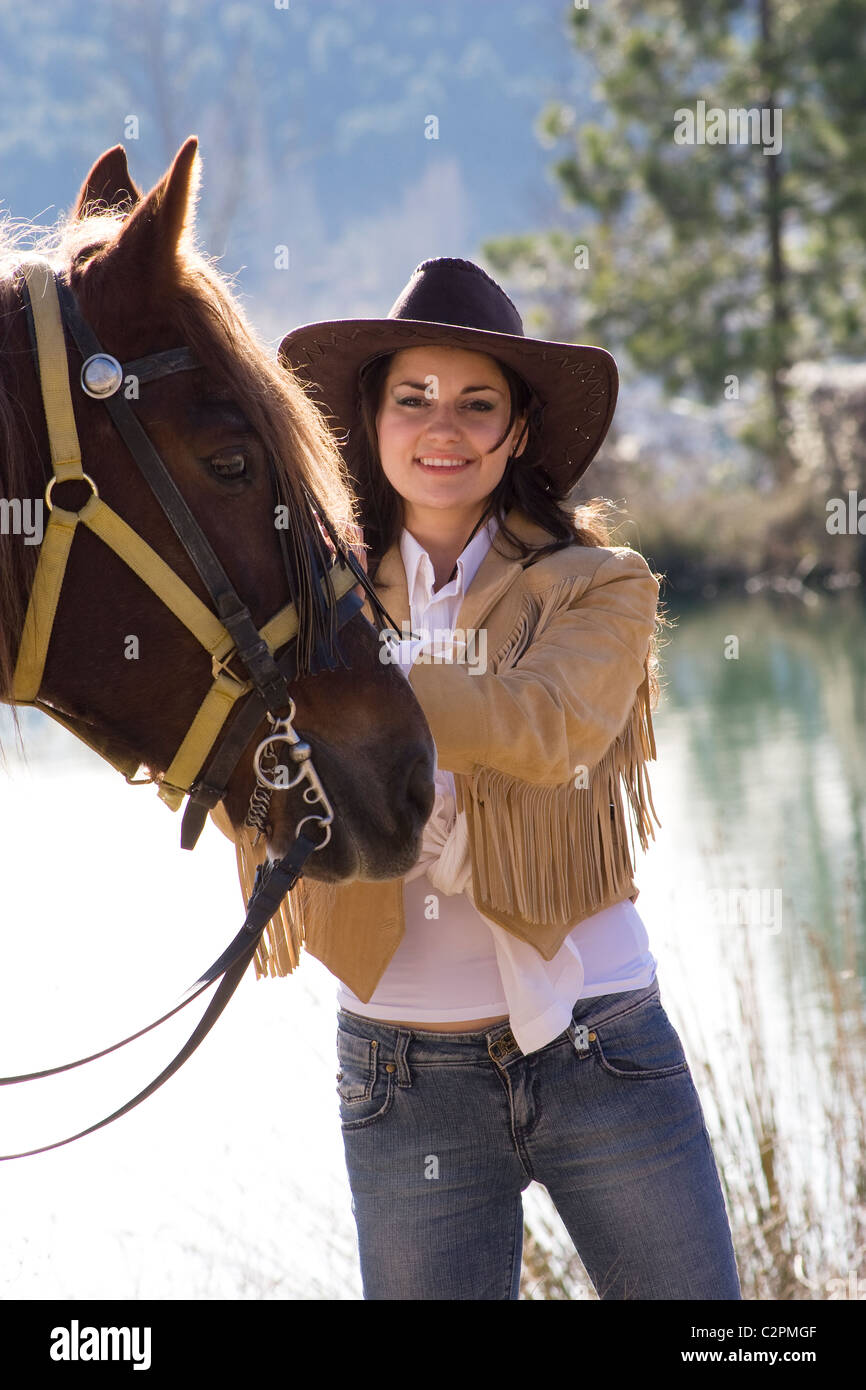 junge Cowgirl und Pferd Stockfoto