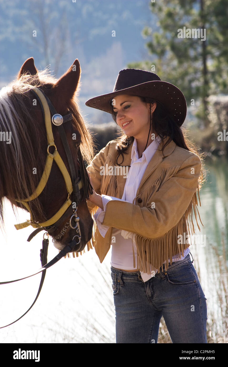 junge Cowgirl und Pferd Stockfoto