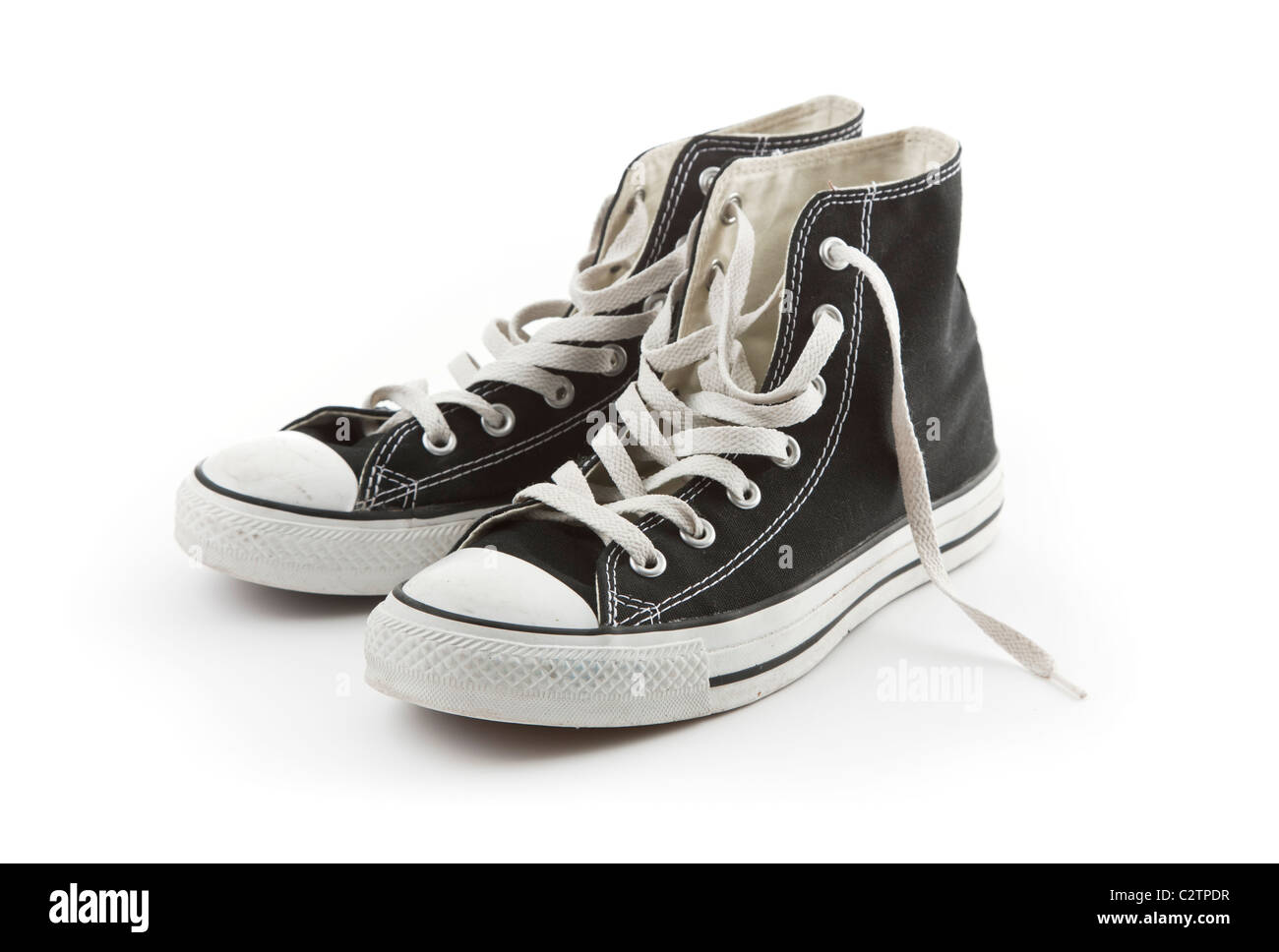 Zwei gebrauchte Schuhe isoliert auf weißem Hintergrund Stockfoto