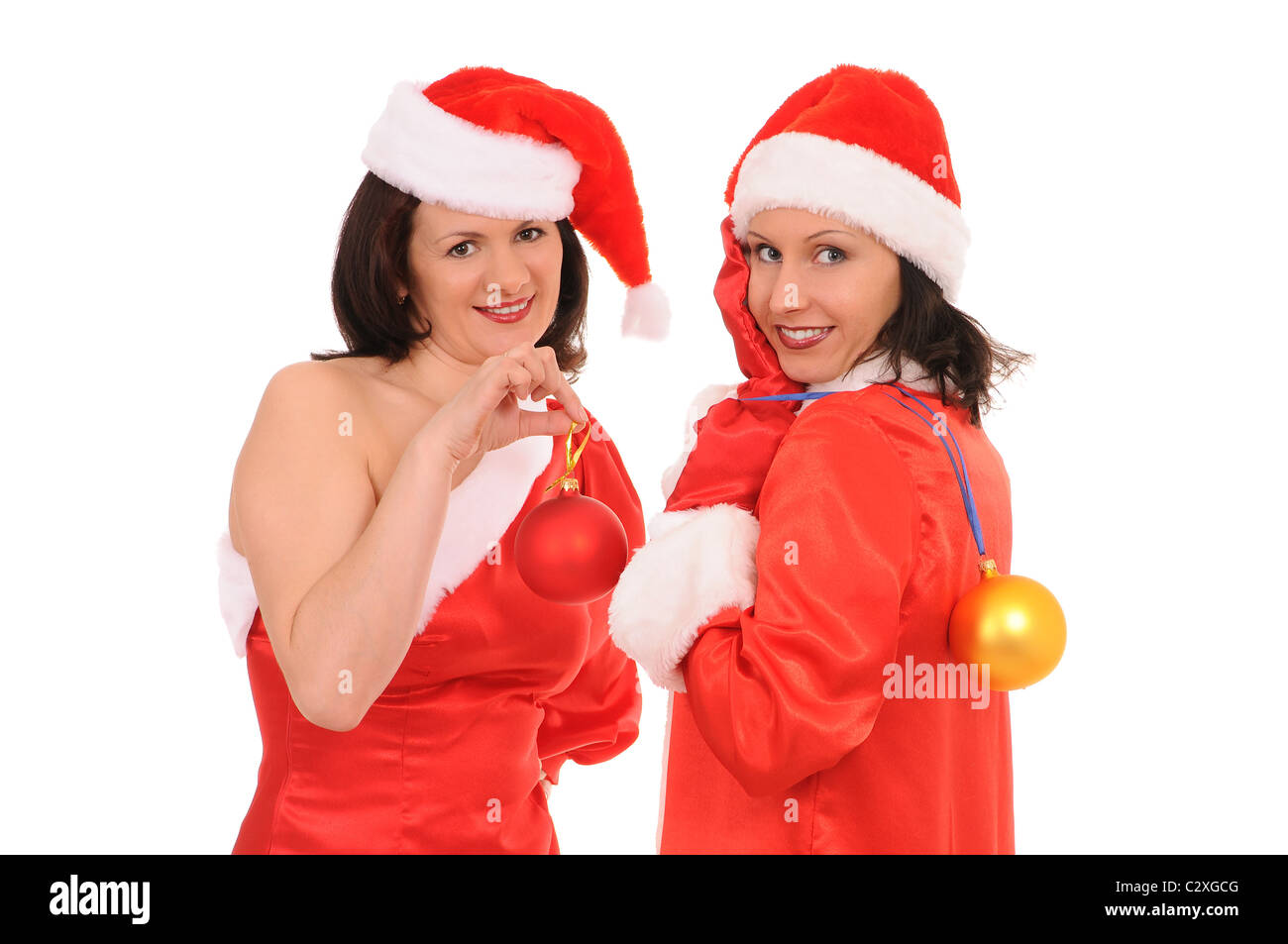 zwei Frauen isoliert Santa auf weißem Hintergrund Stockfoto