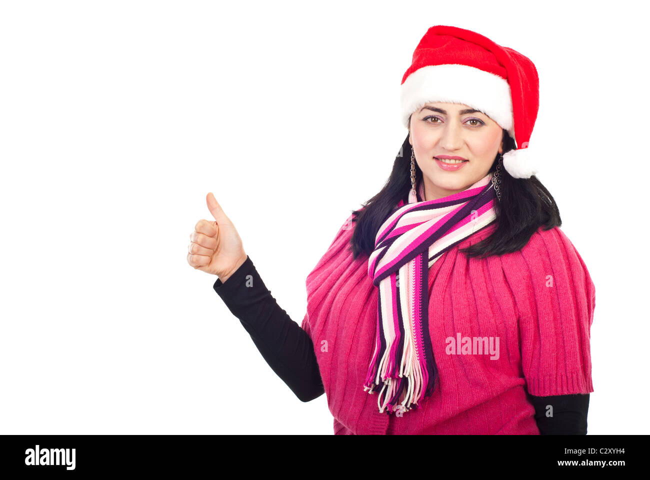 Schöne Mitte Erwachsene Frau mit Nikolausmütze Daumen aufgeben isoliert auf weißem Hintergrund Stockfoto
