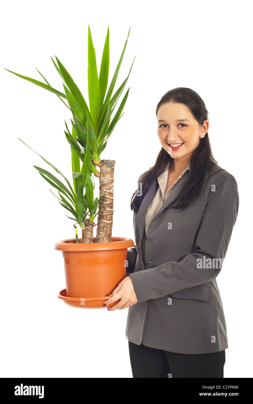 Geschäftsfrau hält eine Vase mit Yucca Pflanze und lächelnd isoliert auf weißem Hintergrund Stockfoto