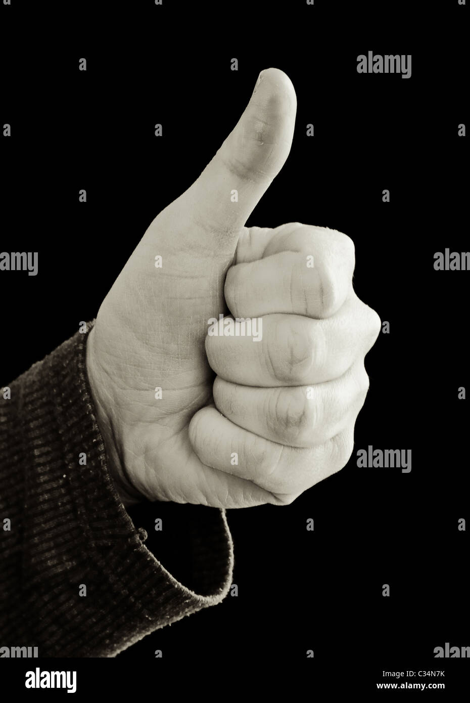 Monochromes Bild von einer Hand (nicht identifizierbare Person) Holding Daumen Stockfoto