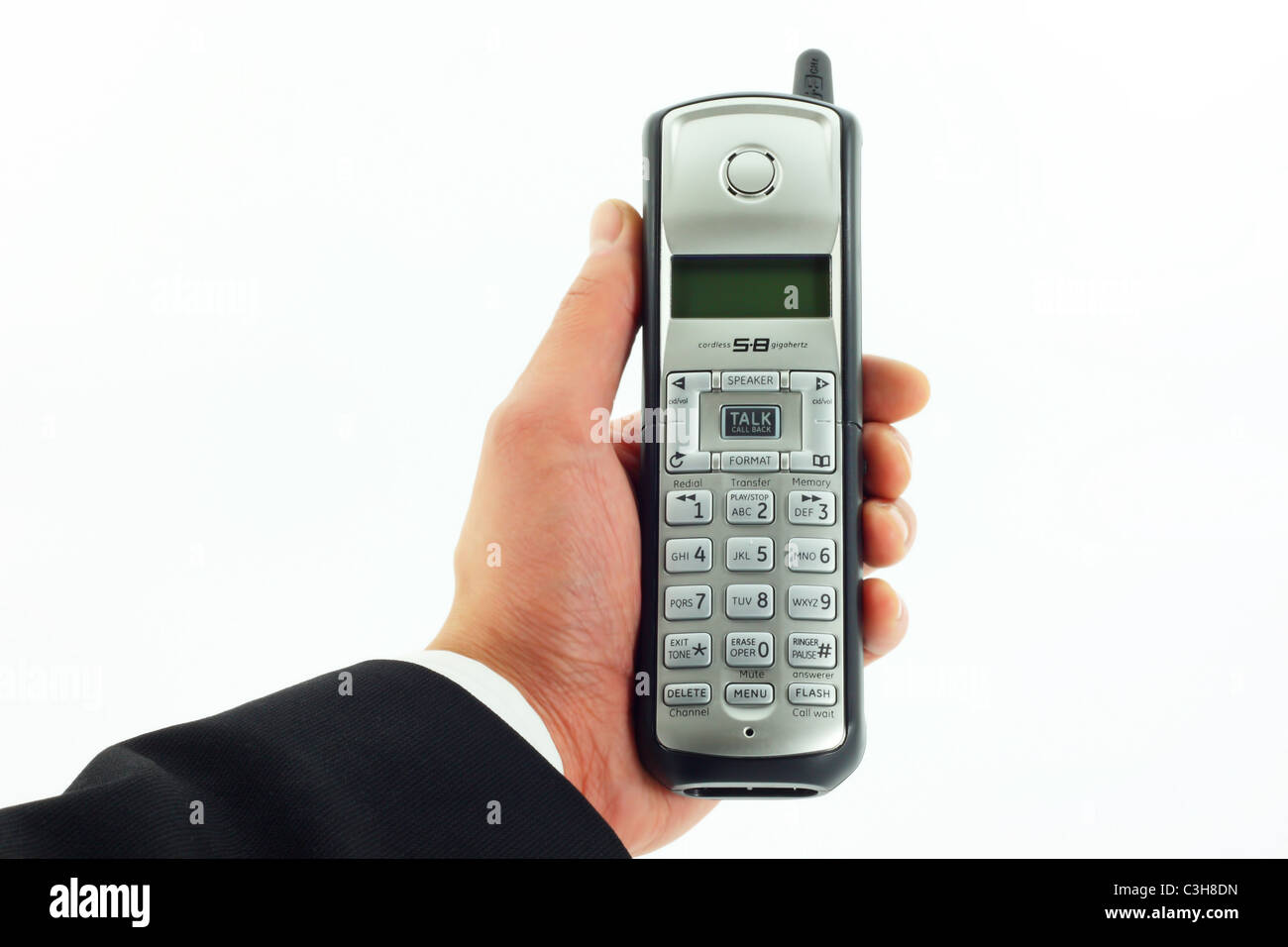 Business-Mann Hand hält ein schnurloses Telefon Stockfoto