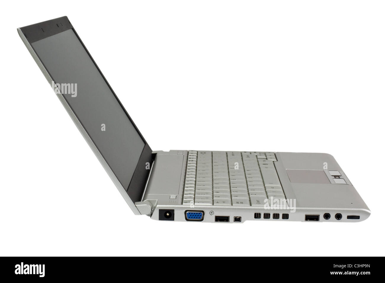 Seitenansicht eines Silber farbigen Laptop Computers isoliert auf weißem Hintergrund Stockfoto