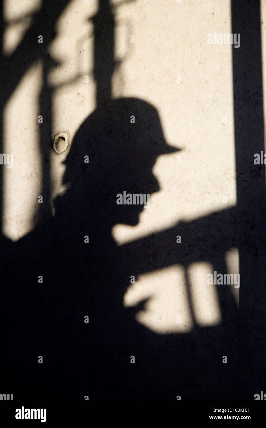 Schatten der Bauarbeiter an Wand Stockfoto