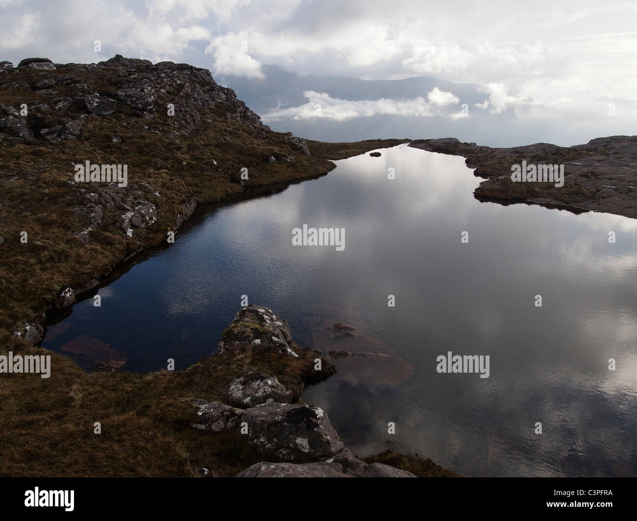 Kleine man auf Beinn Nam Ban in der Nähe von Ullapool, Schottland Stockfoto