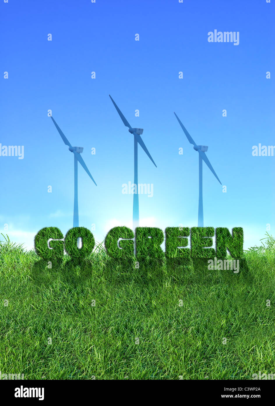Strukturierte gehen grünes Schild frisches Gras. Windkraftanlagen über klare blaue Himmelshintergrund. Stockfoto