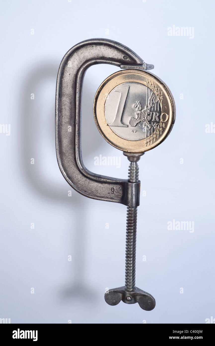 Ein ein-Euro-Münze in einen Schraubstock Stockfoto
