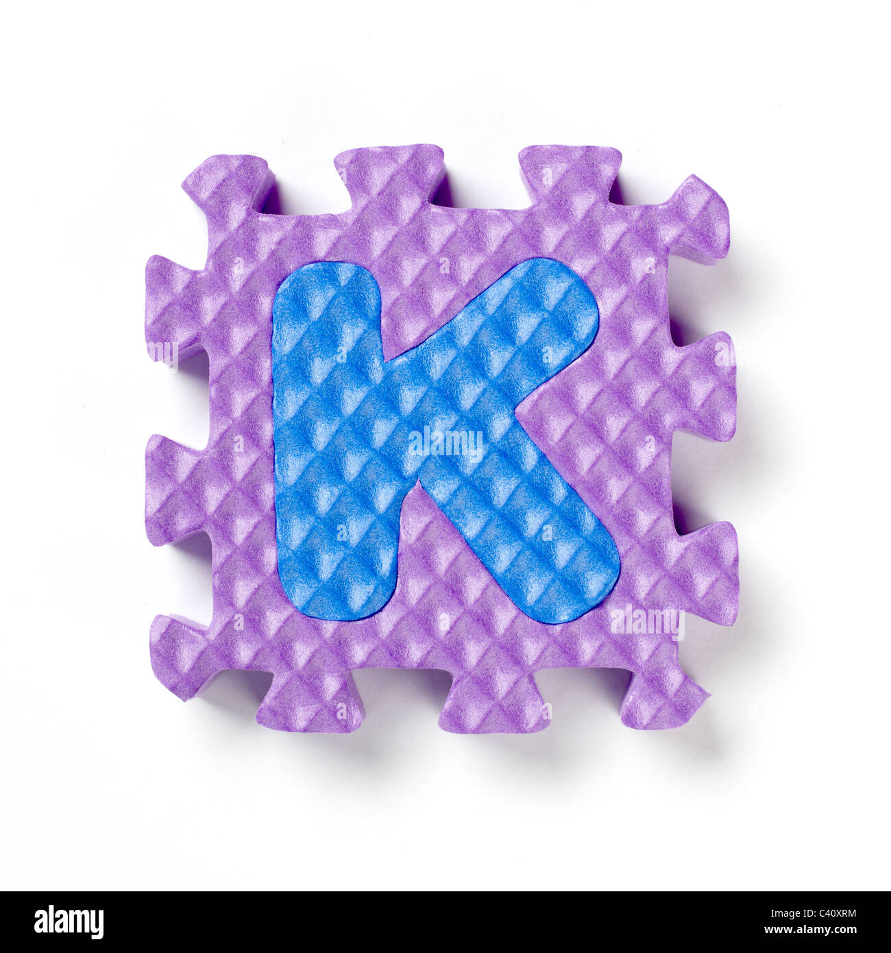 Alphabet-Puzzle-Stück K Stockfoto