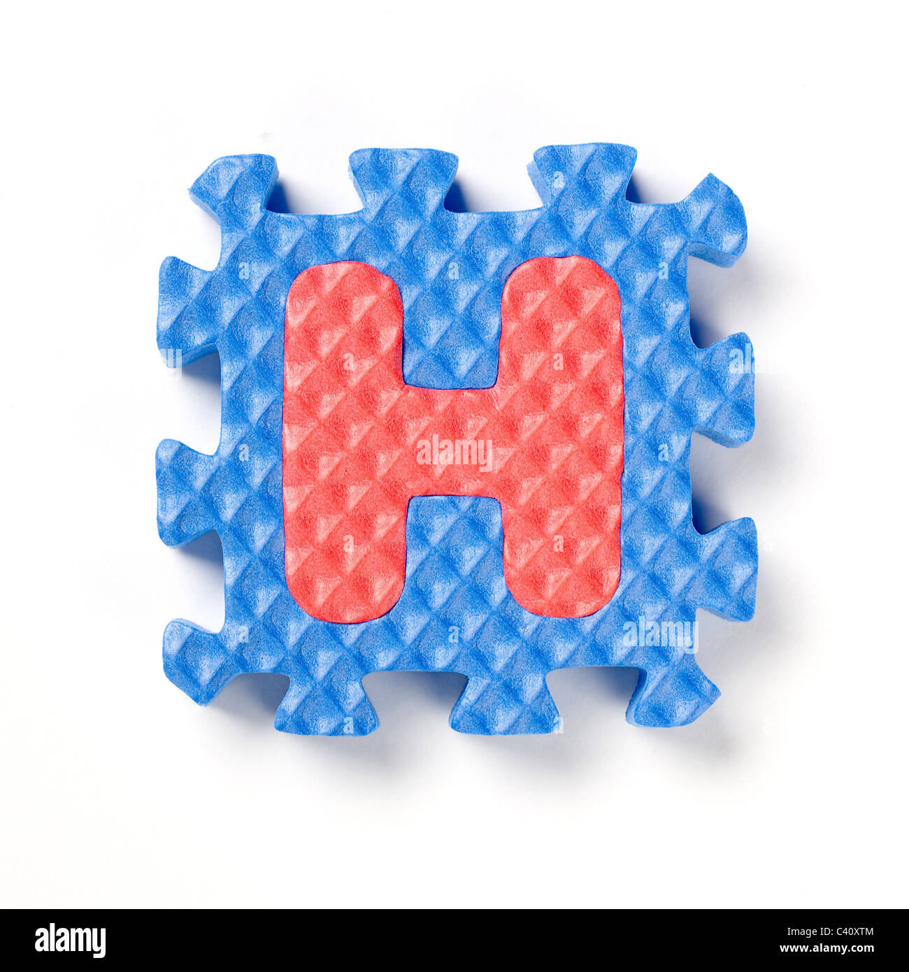 Alphabet-Puzzle-Stück H Stockfoto