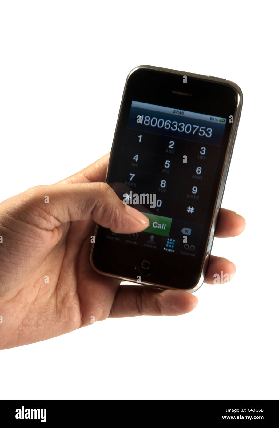 Hand-Einwahl-Iphone in weißem Hintergrund ausschneiden Stockfoto
