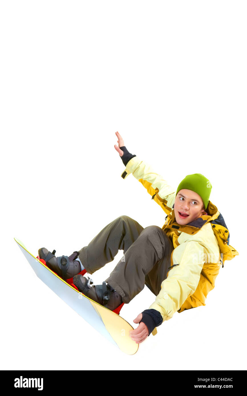 Porträt des jungen mit Snowboard springen und auf der Suche zur Seite Stockfoto