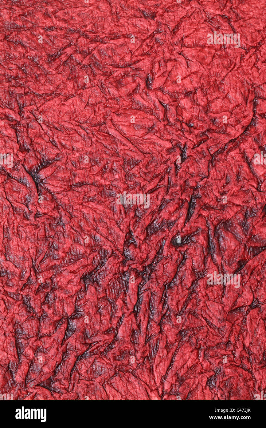 Zerdrücken Sie rotes Papierhintergrund, Textur Stockfoto