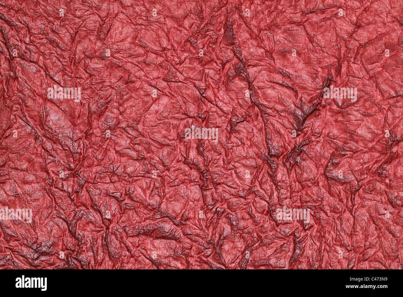 Zerdrücken Sie rotes Papierhintergrund, Textur Stockfoto