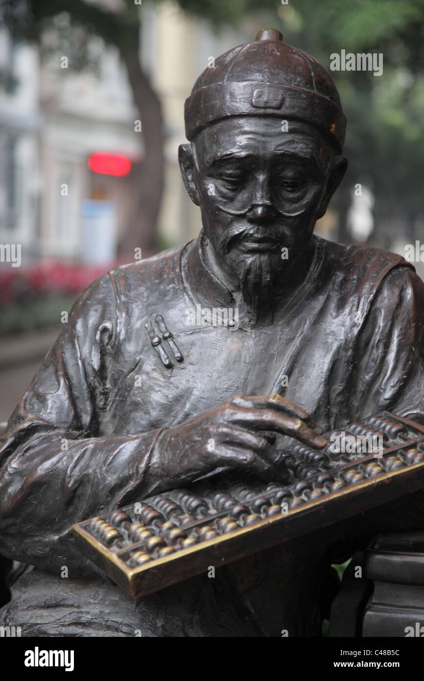 Statue des Mannes mit Abacus, Guangzhou, China Stockfoto