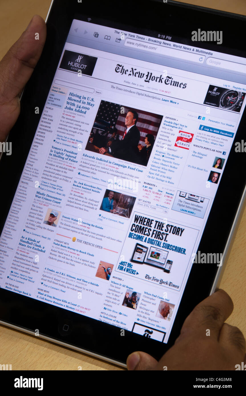 iPad mit "New York Times" Online-Website zeigt globale Märkte Nachrichten Stockfoto