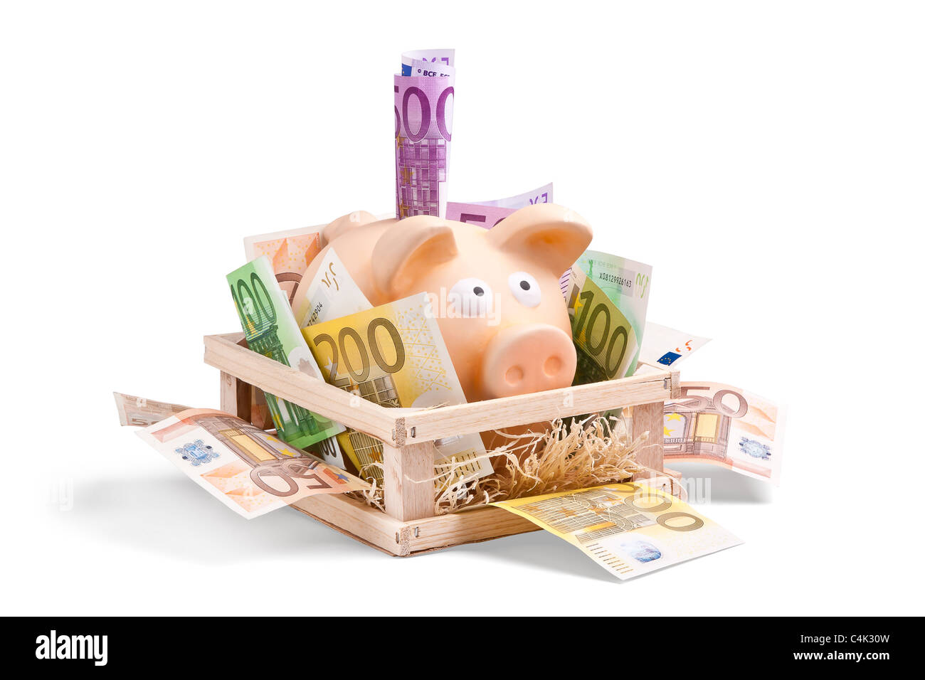 Rich Piggybank voll von Euro-scheinen in seiner Box (Haus) Stockfoto