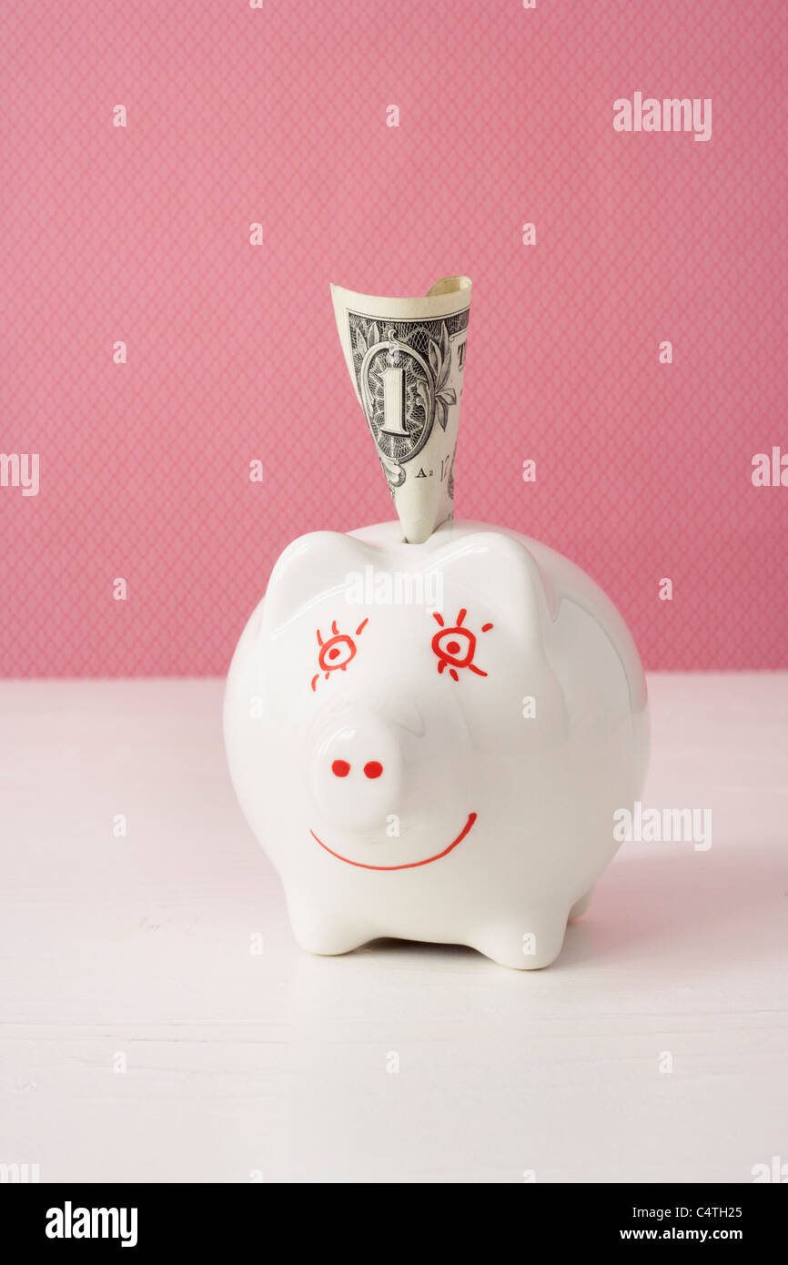 Sparschwein mit amerikanischen Währung Stockfoto