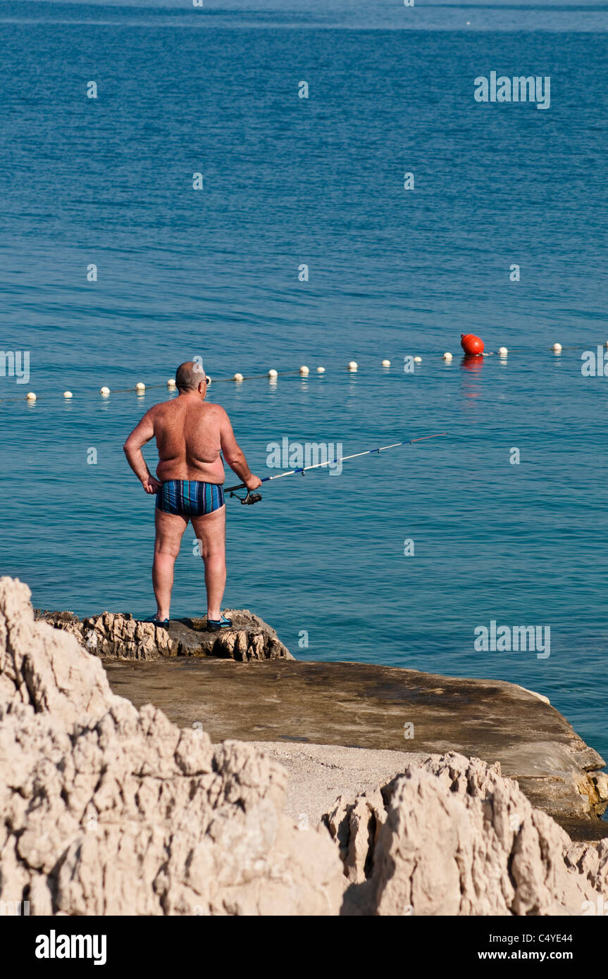 Mann Angeln, Makarska, Kroatien Stockfoto