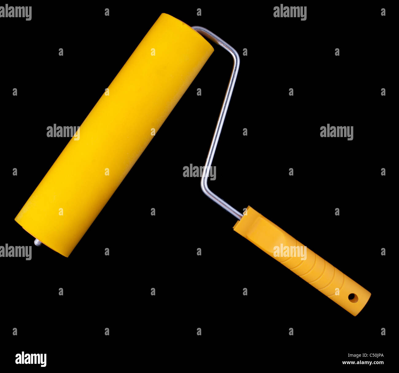 Gelbe Farbroller, auf schwarzem Hintergrund isoliert Stockfoto