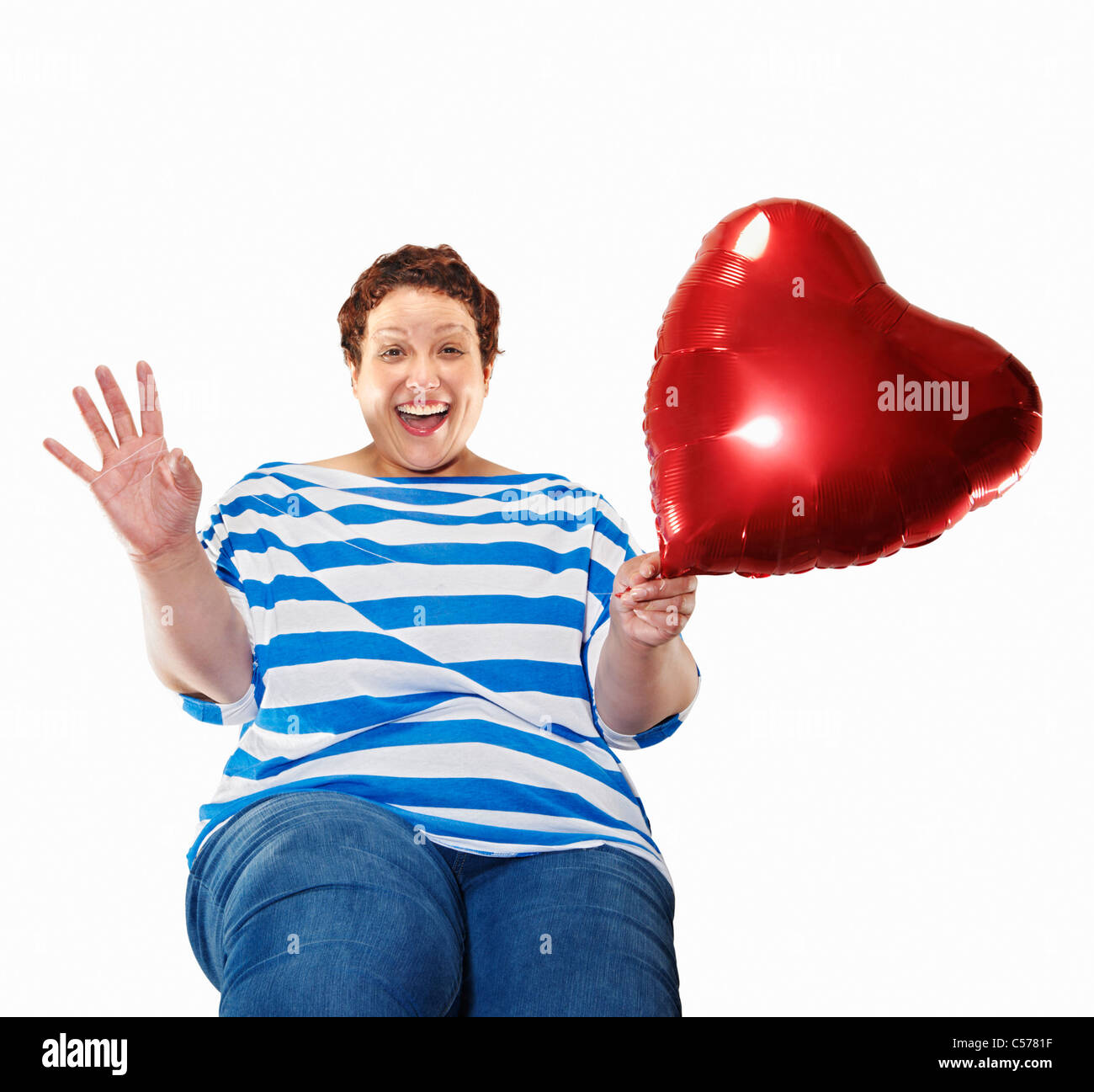 Große Frau mit Herz-Ballon Stockfoto