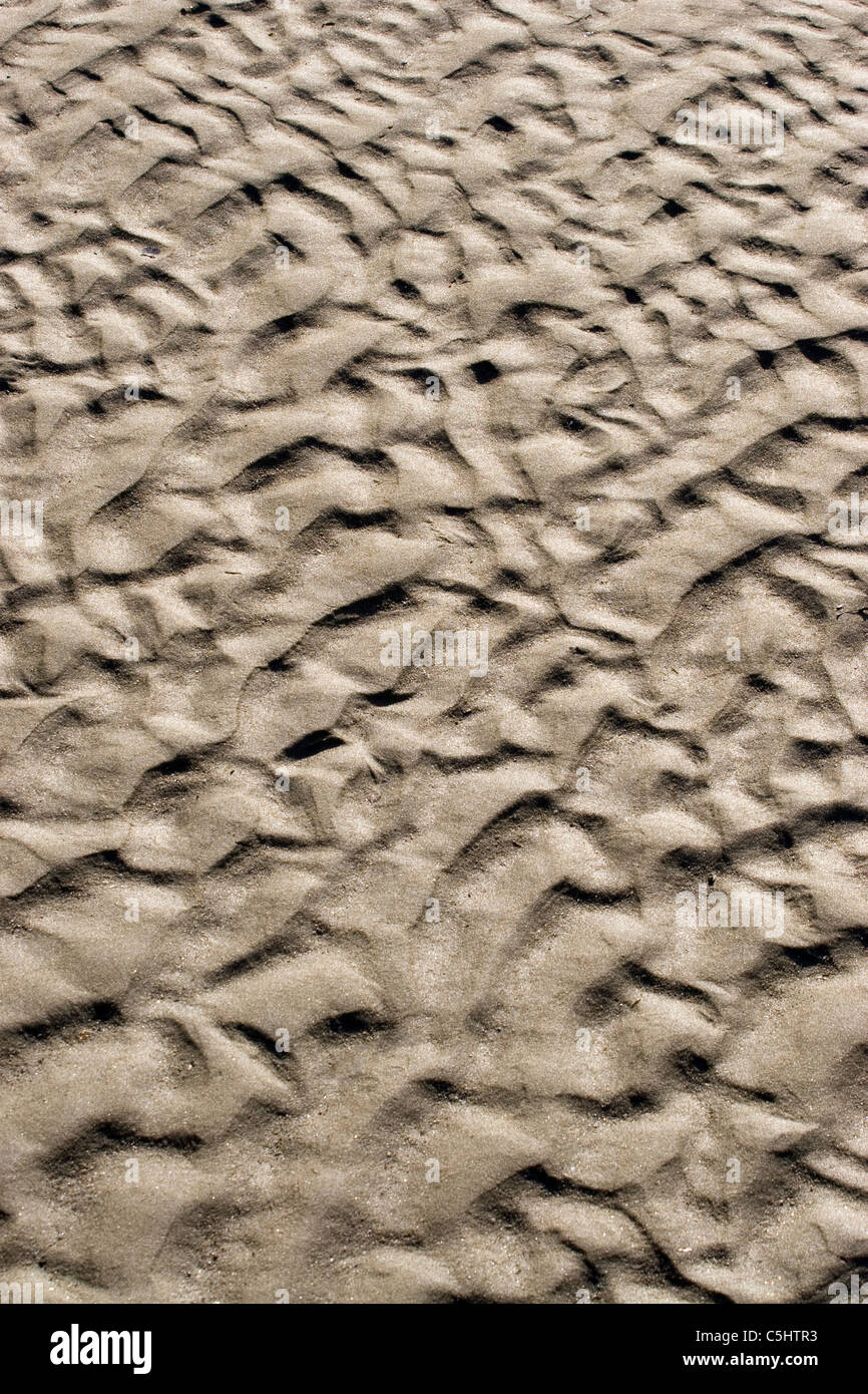 Eine Nahaufnahme der wellige Sand am Meer. Stockfoto