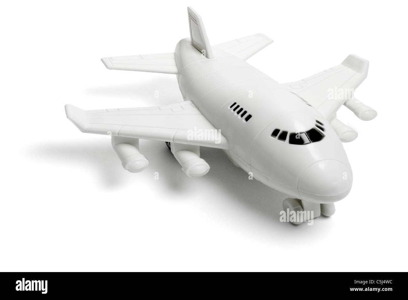 Plastikspielzeug Jet Passagierflugzeug auf weißem Hintergrund Stockfoto