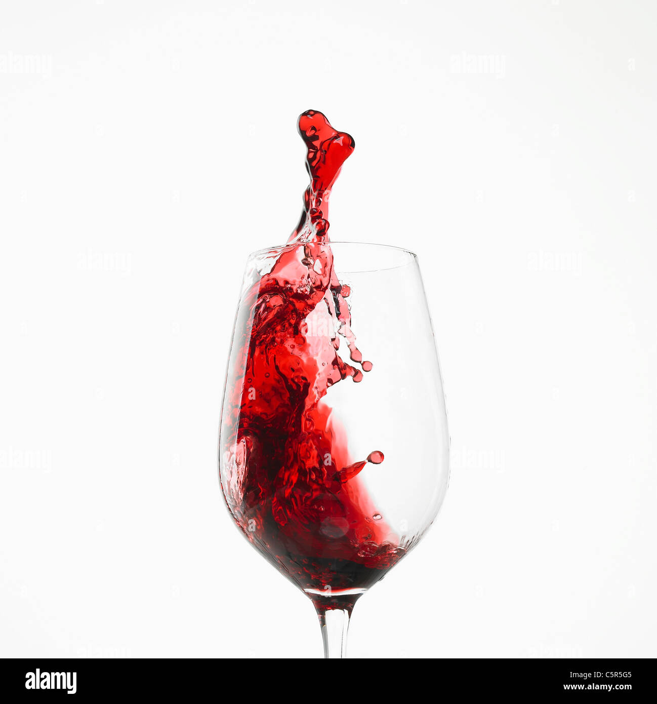 Umzug in ein Glas Wein Stockfoto