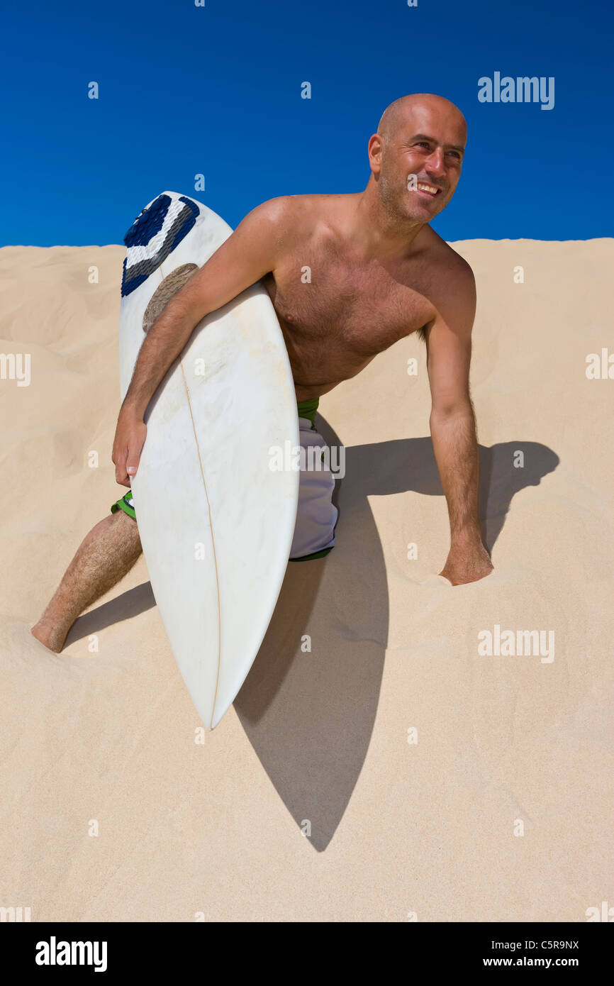 Surfer, die Spaß am Strand. Stockfoto