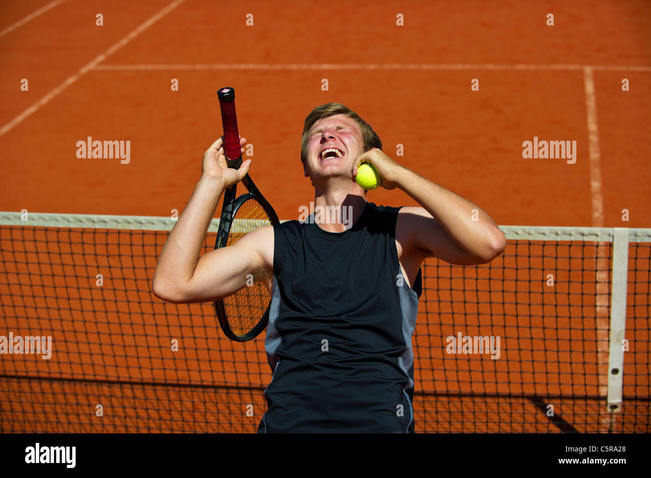 Ein Tennisspieler feiert Sieg das Spiel Satz und Sieg Stockfoto