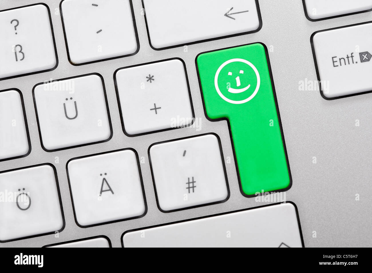 Illustration der Tastatur, die grüne Taste mit Smiley-Gesicht, Nahaufnahme Stockfoto